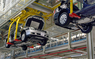 Vehicles hanging in a factory