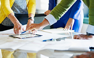 Co-workers discussing project in office conference